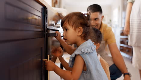 Family,-children-and-open-drawer-in-home