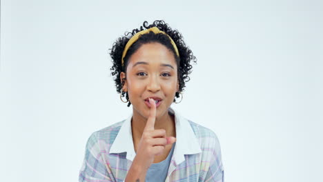 Secret,-face-and-finger-of-woman-on-lips-in-studio