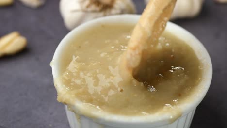 Close-up-pf-garlic-paste-in-a-container-on-table-,
