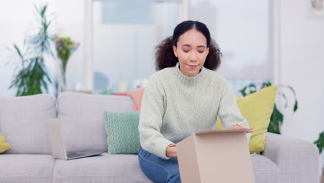 Woman,-box-and-headphones-in-delivery