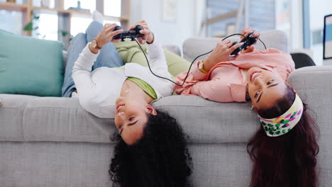 Women-friends,-couch-and-controller-for-gaming