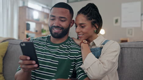 Couple,-happy-and-scroll-with-phone-on-sofa