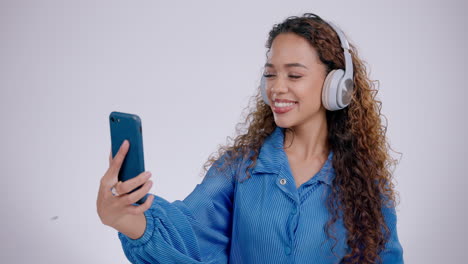 Happy-woman,-peace-or-headphones-for-selfie