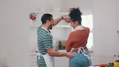Laugh,-happy-and-couple-dance-in-the-kitchen
