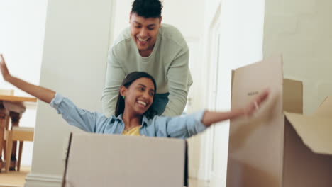 Moving,-boxes-and-man-push-woman-for-fun