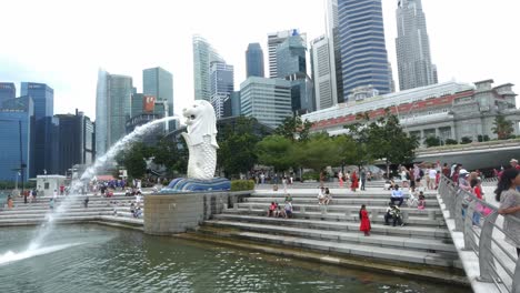 Singapore-12-june-2022-merlion-park-with-people-and-hotel-buildings-,
