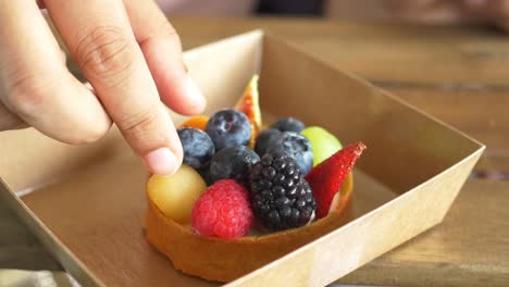 Women-eating-berry-fruit-tart