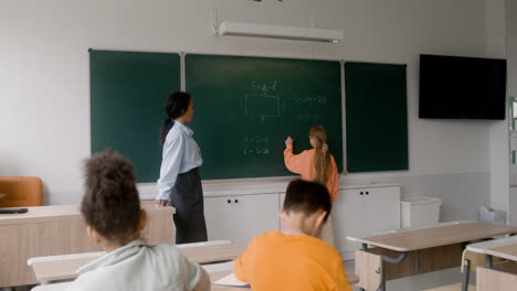 Teacher-and-pupil-at-the-blackboard.