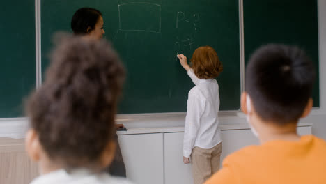 Teacher-and-pupil-at-the-blackboard.
