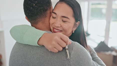 Happy-couple,-real-estate-and-hug-with-keys-in-new