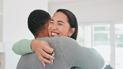 Happy-couple,-real-estate-and-hug-with-keys-to