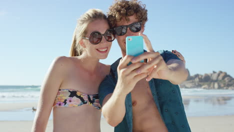 beautiful-Caucasian-couple-taking-selfies-on-the-beach