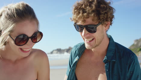 beautiful-Caucasian-couple-taking-selfies-on-the-beach-man-with-open-shirt