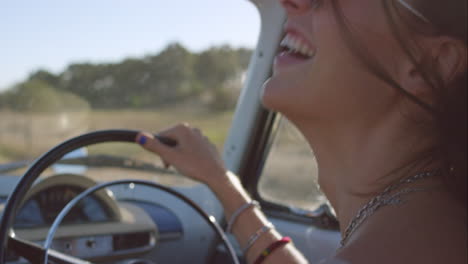 beautiful-girl-driving-vintage-car-on-road-trip