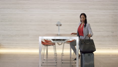 Beautiful-Smart-African-American-Business-woman-working-on-laptop-in-lobby