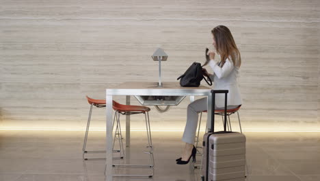 Beautiful-Smart-Business-woman-working-on-digital-table-in-lobby