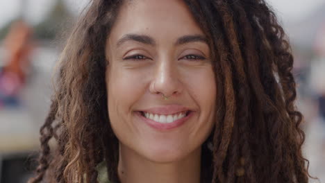 Portrait-mixed-race-woman-with-dredlocks-smiling
