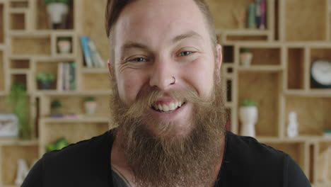 close-up-portrait-of-young-cheerful-hipster-man-with-beard-laughing-happy-feeling-confident