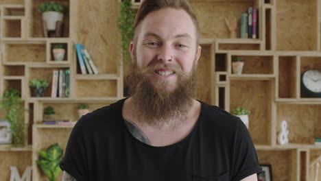 close-up-portrait-of-young-cheerful-hipster-man-with-beard-laughing-happy-feeling-confident