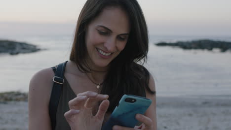 portrait-of-lovely-elegant-woman-texting-using-smartphone-on-beautiful-calm-beach