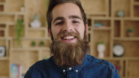 portrait-of-handsome-young-hipster-businessman-with-beautiful-beard-laughing-cheerful