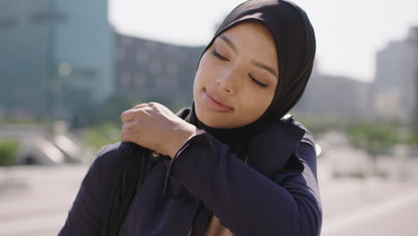 slow-motion-portrait-of-beautiful-muslim-mixed-race-woman-in-sunny-urban-city-looking-confident-at-camera-professional-business-intern