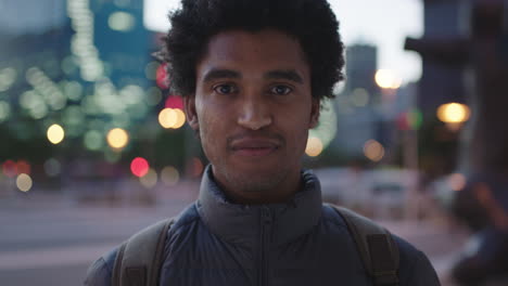 portrait-of-handsome-mixed-race-man-smiling-wearing-cozy-jacket-enjoying-urban-evening-in-city