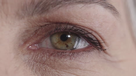 close-up-mature-woman-opening-eye-looking-at-camera-healthy-eyesight