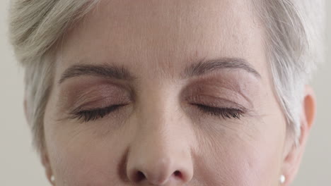 close-up-elderly-woman-opening-green-eyes-looking-at-camera-aging-beauty-healthy-eyesight