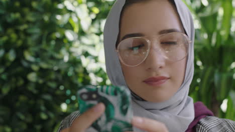 close-up-portrait-beautiful-muslim-business-woman-using-smartphone-texting-messaging-social-media-sharing-ideas-enjoying-mobile-phone-communication-wearing-hijab-headscarf-in-modern-office