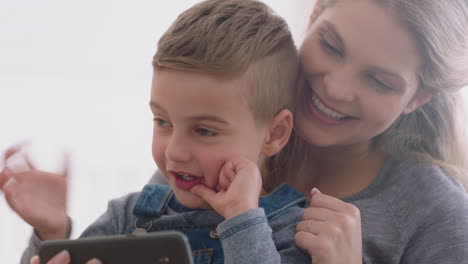 mother-and-child-using-smartphone-having-video-chat-little-boy-with-mom-waving-sharing-vacation-weekend-with-son-enjoying-chatting-on-mobile-phone-4k-footage