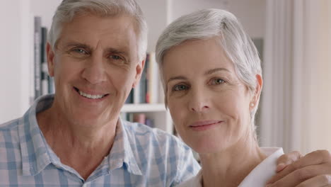 portrait-happy-old-couple-smiling-enjoying-retirement-together-sharing-romantic-anniversary-embracing-at-home-4k-footage