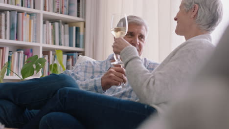happy-old-couple-drinking-wine-relaxing-on-sofa-at-home-making-toast-celebrating-anniversary-enjoying-romantic-relationship-on-comfortable-retirement-4k-footage