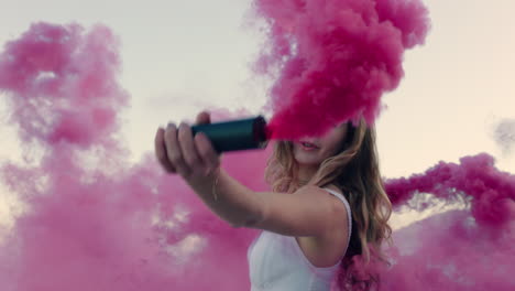 beautiful-woman-waving-pink-smoke-bomb-dancing-on-beach-at-sunrise-celebrating-creative-freedom