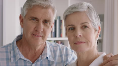 portrait-happy-old-couple-smiling-enjoying-retirement-together-sharing-romantic-anniversary-embracing-at-home-4k-footage
