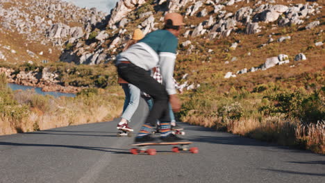young-multi-ethnic-friends-longboarding-together-riding-skateboard-cruising-downhill-on-countryside-road-having-fun-enjoying-relaxed-summer-vacation