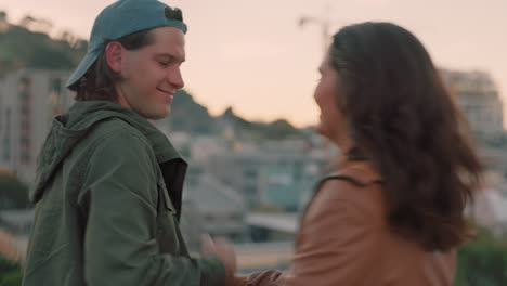 happy-caucasian-couple-dancing-on-rooftop-sharing-intimate-connection-embracing-romance-hanging-out-enjoying-beautiful-view-of-city-at-sunset