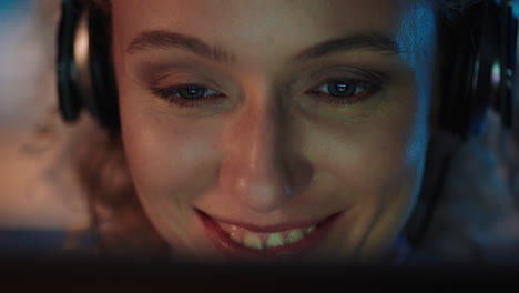 close-up-portrait-beautiful-woman-using-tablet-computer-browsing-online-enjoying-listening-to-music-wearing-headphones