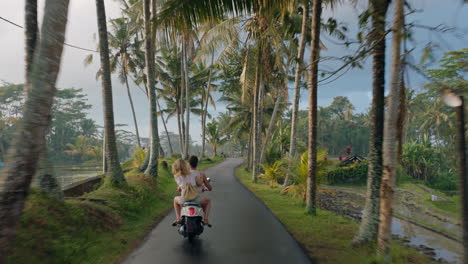travel-couple-riding-motorcycle-on-tropical-island-exploring-beautiful-travel-destination-on-motorbike-ride-in-morning-mist
