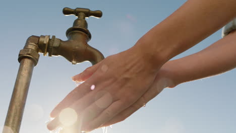 woman-washing-hands-under-tap-rinsing-with-freshwater-flowing-from-faucet-save-water-concept