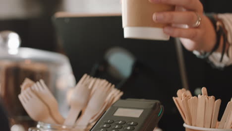close-up-customer-making-contactless-payment-using-smart-watch-mobile-money-transfer-buying-coffee-in-cafe-enjoying-service-at-restaurant