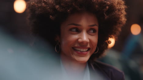 beautiful-woman-with-afro-hairstyle-hanging-out-with-friends-in-restaurant-wingking-playfully-laughing-enjoying-socializing-at-party-gathering