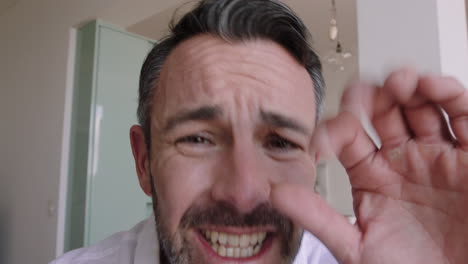 attractive-caucasian-man-having-video-chat-using-webcam-at-home-waving-at-baby-sharing-lifestyle-father-enjoying-online-connection-on-horizontal-screen