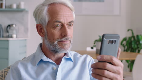 mature-man-having-video-chat-using-smartphone-enjoying-connection-grandfather-chatting-on-mobile-phone-looking-surprised