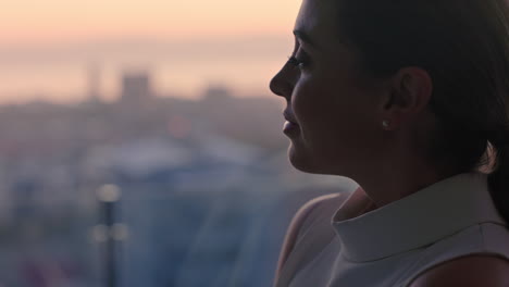 beautiful-business-woman-looking-out-window-contemplating-successful-lifestyle-planning-ahead-enjoying-view-of-city-from-penthouse-at-sunset