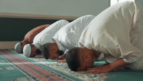 Muslim,-praying-and-men-in-a-Mosque-for-spiritual