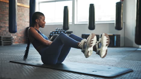 Fitness,-gym-and-black-woman-on-floor-with-ball