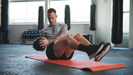 Fitness,-gym-and-man-on-floor-with-ball-for-core