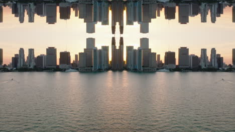 Nice-panoramic-shot-of-high-rise-buildings-in-modern-urban-borough-on-waterfront-against-sunset-sky.-Abstract-computer-effect-digital-composed-footage