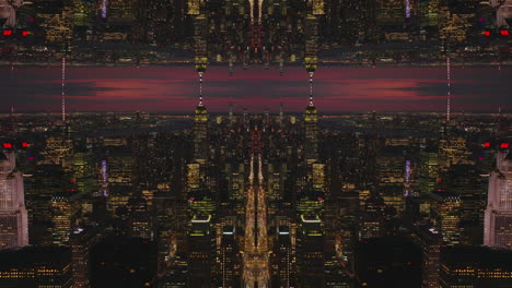 Illuminated-high-rise-buildings-in-city-centre-against-red-sky-at-twilight.-Abstract-computer-effect-digital-composed-footage